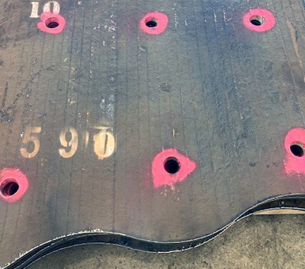 Pink paint showing that the plates have been QA checked